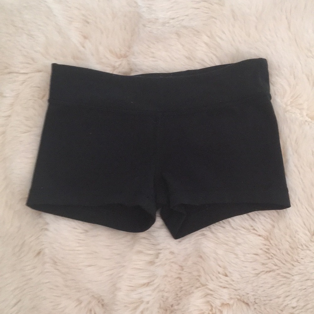 Black Ivivva shorts.